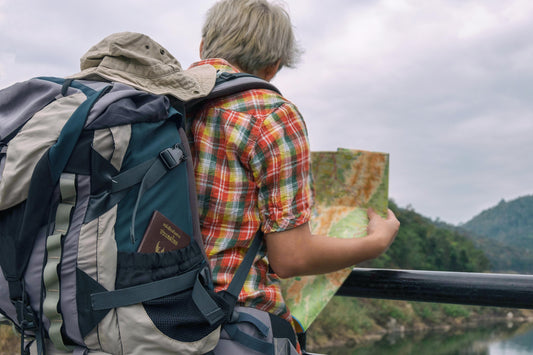 Man Holding Green and Brown Map